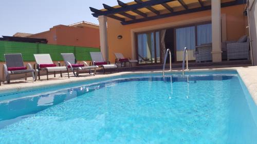 Caleta de Fuste Villa | Beautiful, spacious villa, heated pool, sleeps eight, with quality furnishings