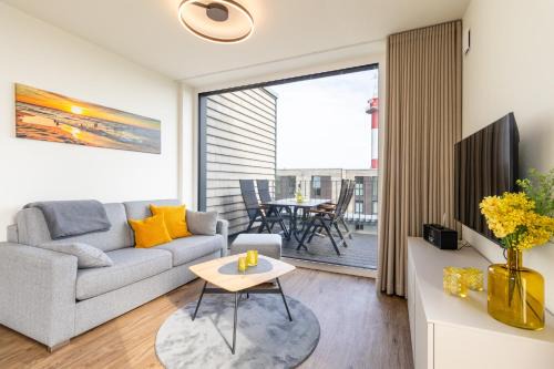 Marienleuchte Apartment | BeltBlick 24 – Moderne Ferienwohnung mit Dachterrasse und Meerblick!