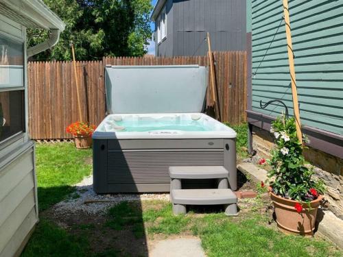 Winooski Falls Mill District Apartment | Bohemian Bungalow with Hot Tub