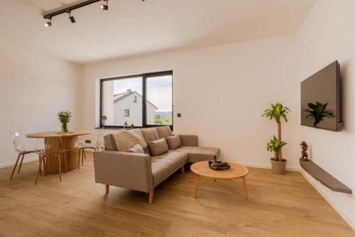 Gerolstein Apartment | Bright Suite I Sauna I TV I Kitchen