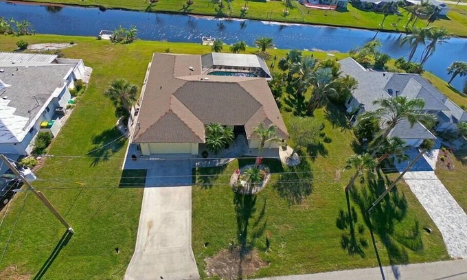 Pebble Beach House | Canal-Side: Pool Home in Rotonda West #61