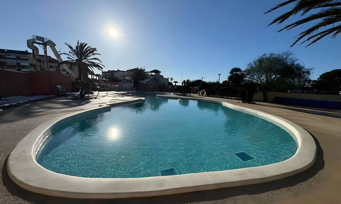Canet-Plage RV Rental | Caravan 'Cosy Vue Sur L'étang' with Sea View, Shared Pool and Air Conditioning