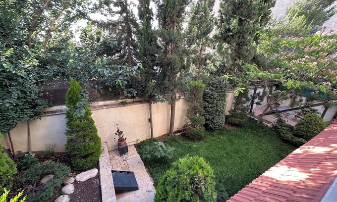 Amman Apartment | Centrally Located Bright 2 BR Apartment with Breathtaking Tropical Tree Garden!