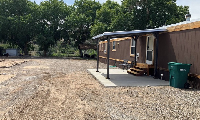 Navajo Dam House | Charming 3-bedroom home on San Juan River, access to river within feet of door.
