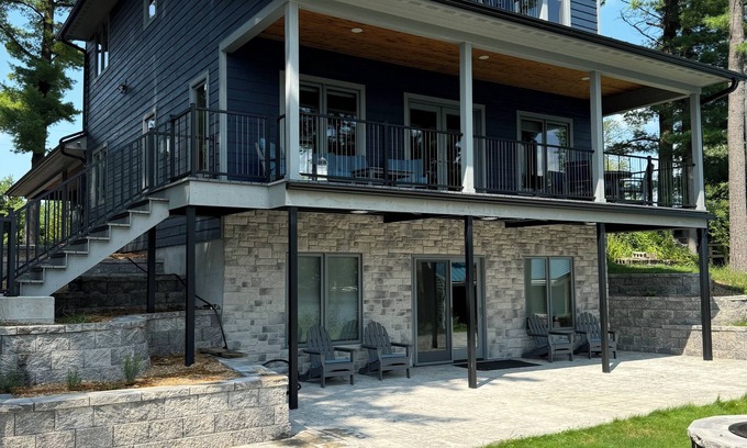 Shawano Hotel | Charming new lake house with beautiful views. Pier for swimming and fishing.