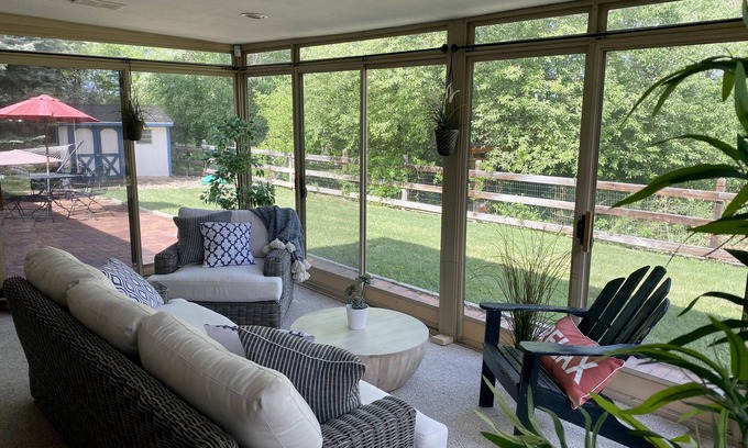 Southeast House | Cheerful three bedroom with stunning sunroom!