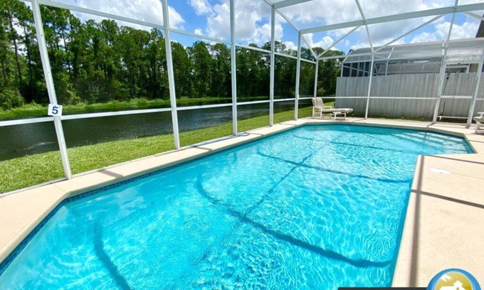 Lindfields House | Chic 4-Bedroom Home w/Pool, Lake View, & Games Room - Minutes from Disney