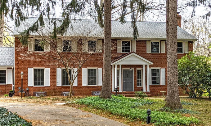 Benton Harbor House | Colonial style 5BR/5BA home tucked in a private, wooded setting w/pool & hot tub