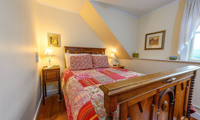 Stowe Bed & Breakfast | Comfortable budget room with queen bed, a stunning view of Mount Mansfield, and all-glass shower stall with full service breakfast included