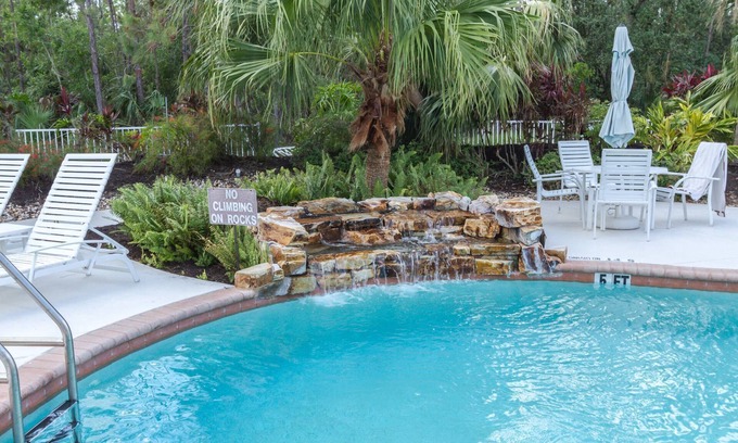 Ole Condo | Coral Falls - 1st floor condo - private screened lanai w/views of indoor 65" TV & steps to pool/spa