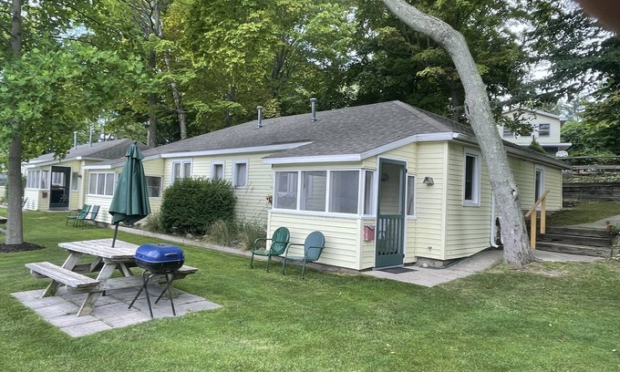 Ludington Cottage | Cottage 2 is a 2 bedroom 25’ from its boat dock & Hamlin Lake