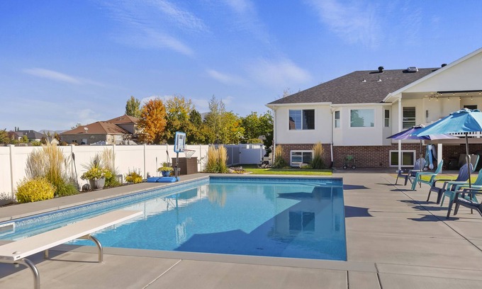Layton House | Cozy basement with large yard
