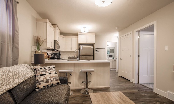 Lethbridge House | Cozy one bedroom suite with a pullout in the living room.