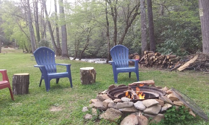 Murphy RV Rental | Creek Front Safari Tent-Furnished, relaxing under the stars, Firepit, Smores.