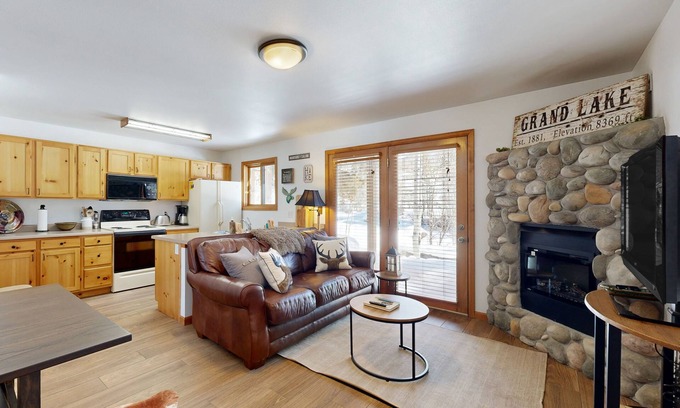Grand Lake Condo | Creekside condo w/patio, fireplace & open layout perfect for a group getaway
