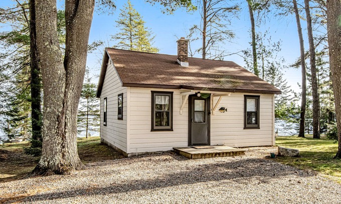 Presque Isle Cabin | Dog-friendly lake cabin with waterfront views & on-site swimming/fishing/boating