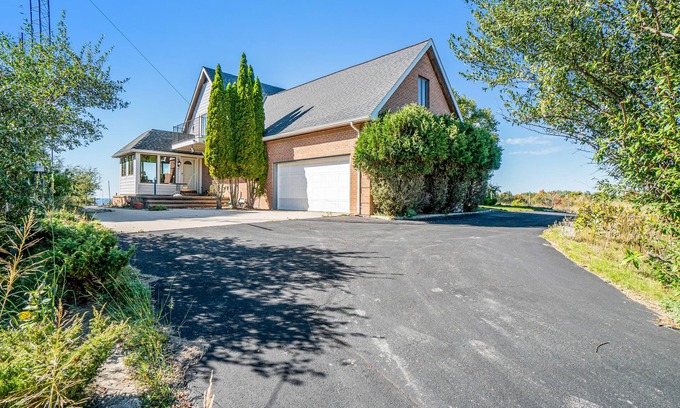 Arcadia House | Dog-friendly, lake view home with three season room, fireplace, video projector