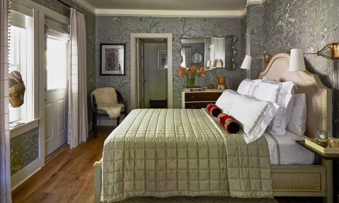 Lenox Bed & Breakfast | Elegant Carriage House room with a queen bed and private patio.