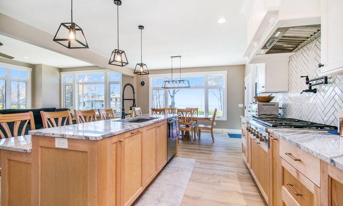 Riverside House | Enchanting lakefront home with pool, hot tub, firepit, game room, & washer/dryer