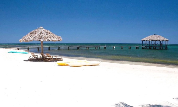 Palmetto Bay House | Family Friendly Beach Bungalow | Private Eco Dive Resort With A Pool & Beach