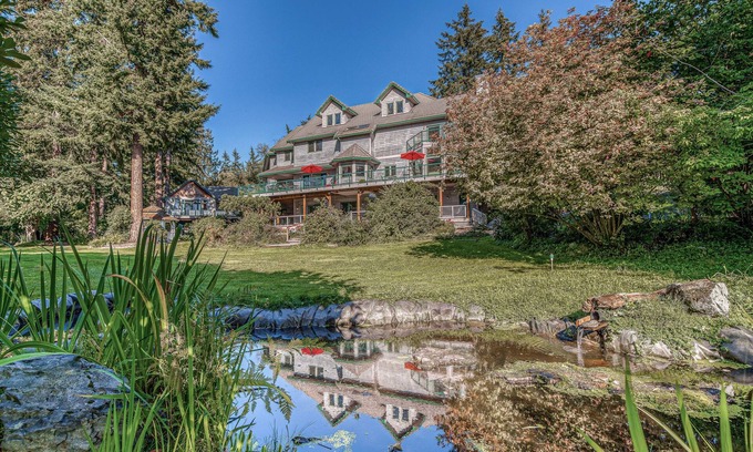 Clinton House | Family friendly water view escape with deck, games and garden views