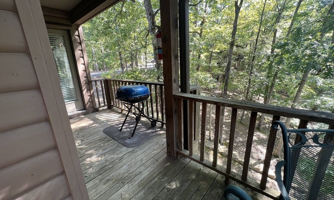 Mount Ida Condo | Forest view, log-sided two bedroom, two bath condo on Lake Ouachita. by RedAwning