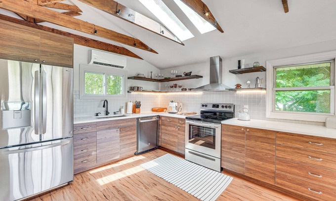 Lincoln Park House | Game Room & Yard: Mid-Century Modern Kingston Home