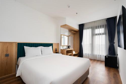 District 4 Hotel | Haven Hut Riverside Hotel