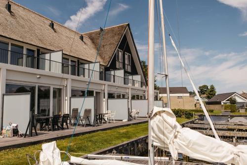Heeg Resort | Herenhuizen 6 of 8 persoons geschakeld - Boutique Parc Pharshoeke
