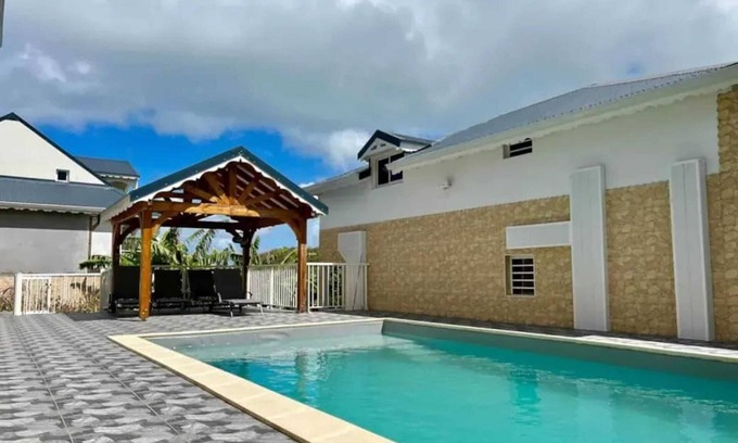 Bas Vent House | Homerez - Spacious House in Deshaies with Shared Pool