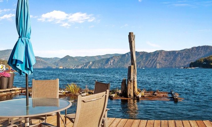 Bayview Boat Rental | IdaBlu, a floating house with an unobstructed view of the lake and mountains.