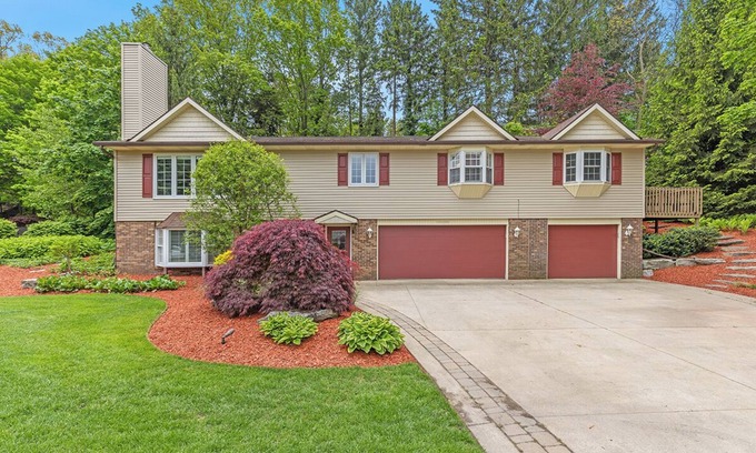 Holland House | Ideal Lakeshore location in serene wooded landscape with waterfalls.