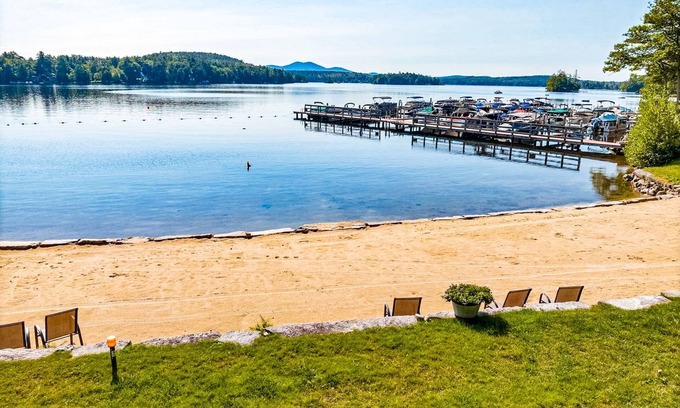 Meredith House | Idyllic lake retreat with beach access, firepit, wraparound porch, & great views