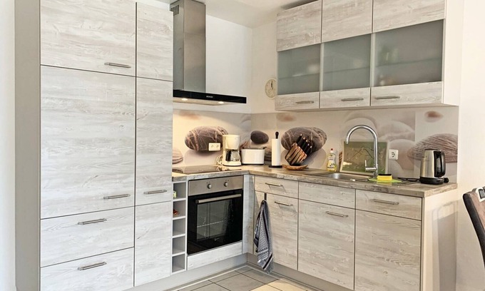 Kronsgaard Apartment | In Kronsgaard, only 1 km from the Baltic Sea beach, the cozy vacation apartment "Strandgold" awaits you, with a fenced garden for your four-legged friend, to enjoy your well-deserved vacation far away from the stress of everyday life