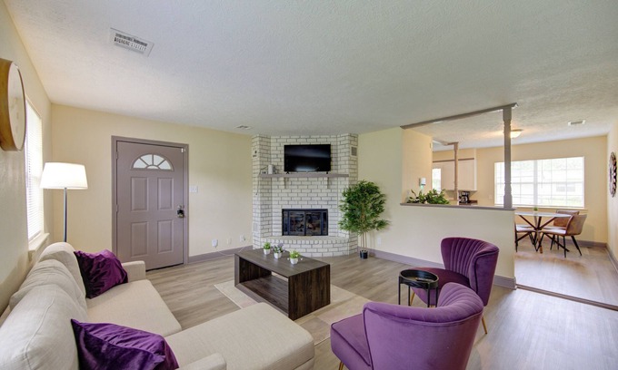 Beaumont Apartment | Indoor fireplace with patio and pool table