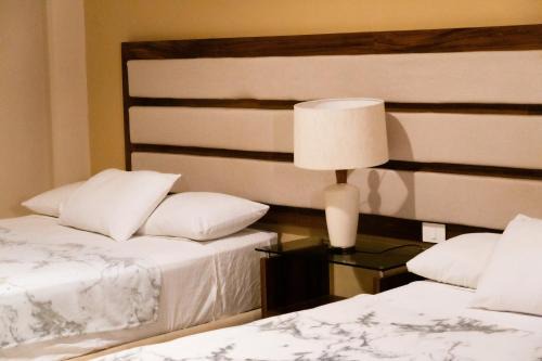 Alfredo V. Bonfil Apartment | Infinity Suites habitación triple