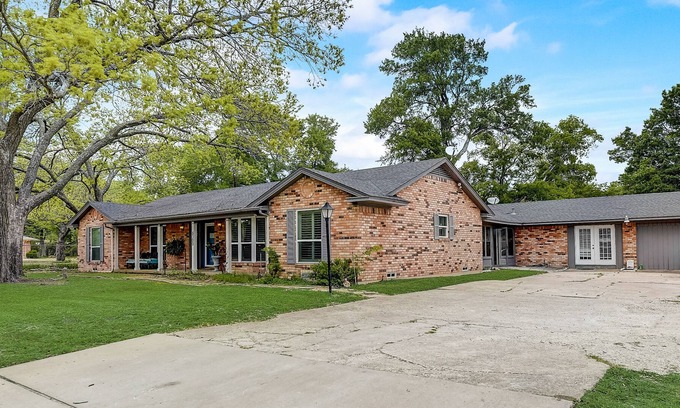 Sachse House | Inviting dog-friendly home with pool, full kitchen, central AC, & W/D