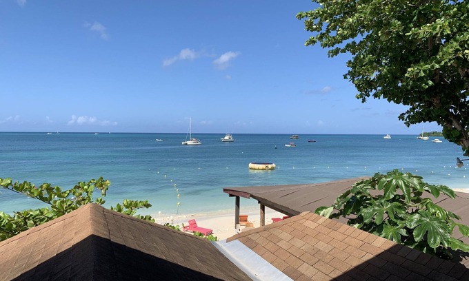 Negril Villa | King Suite at Oceanview Resort in Jamaica - Enjoy 7 Miles Of White Sand Beach! 1 Bedroom Villa by RedAwning