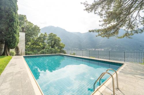 Nesso Apartment | Lakefront apartment with a view, parking and swimming pool