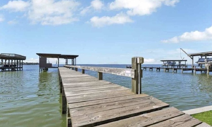 West Livingston House | Large Home With Boat Dock and Picture Perfect Sunsets Sleeps 14