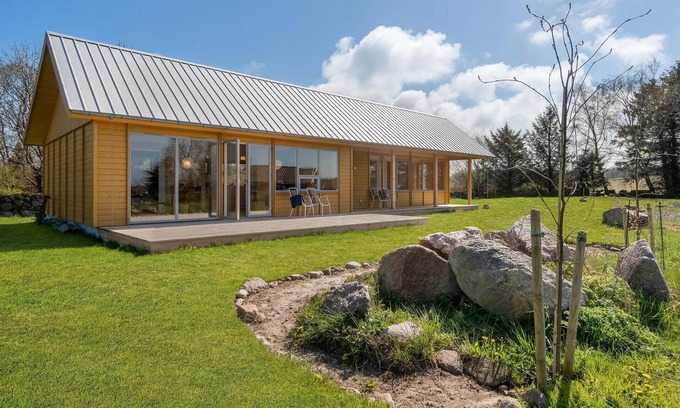 Vang House | Look forward to your vacation in this modern vacation home with sea view.