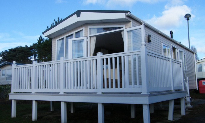 Hamworthy House | Lotus 2 bedroom dog friendly caravan with veranda offers a stunning sea view.