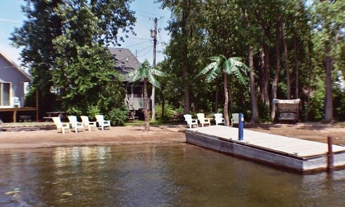 Wolcott Cottage | Lure Cottage, Right on the beech. Palm Trees, Free Motor Boat.