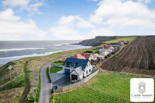 Cayton Bay Villa | Luxury 4-Bedroom Beachfront Home with Hot Tub & Games Room