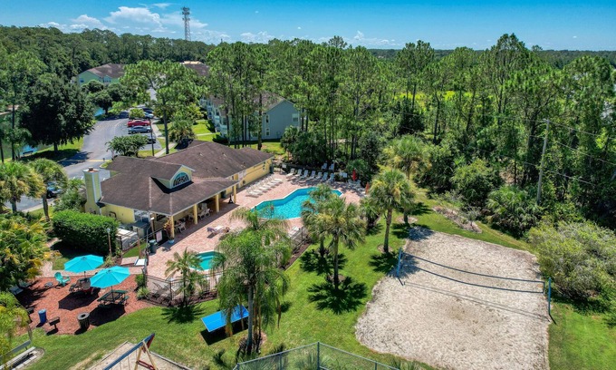Royal Palm Bay Condo | Magical condo with playground, pool, hot tub, tennis courts, & washer/dryer