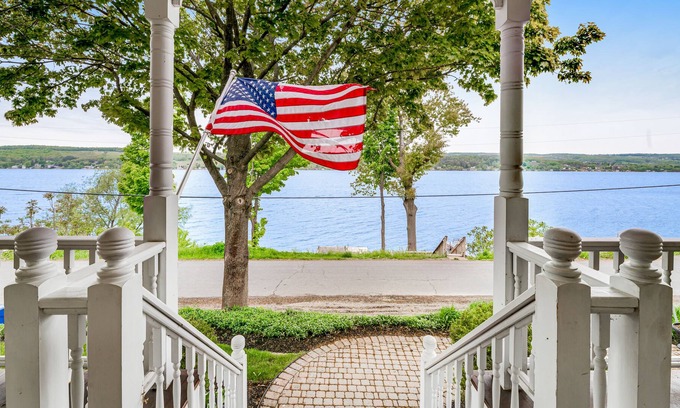 Town of Milo House | Majestic lakefront dog-friendly home with game room, fireplace, partial AC