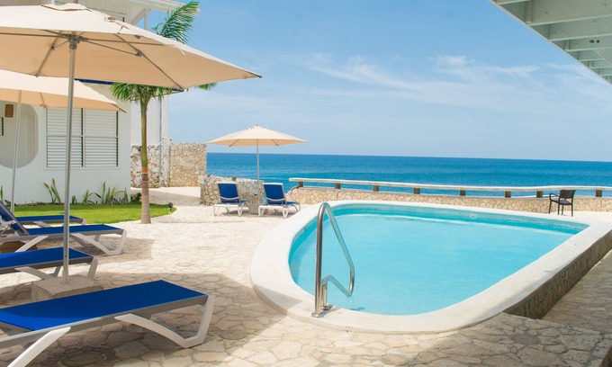 West End Resort | Mango Rooms at Begona is a cliffside hotel with stunning Caribbean sunset views