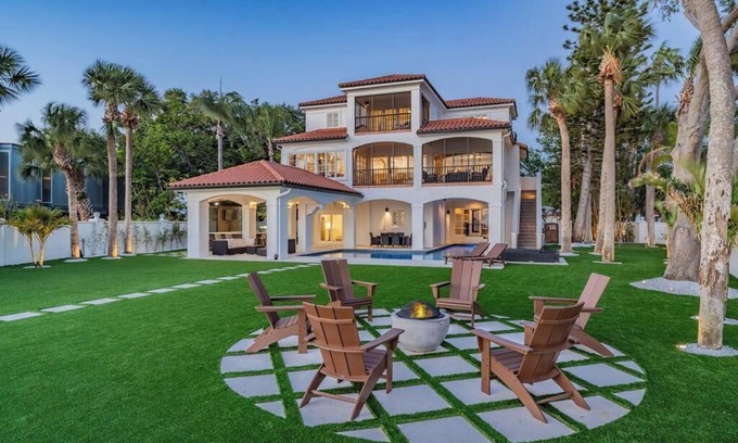 Palm Harbor House | NEW Waterfront 6 bedroom home with large pool and luxurious outdoor living area!