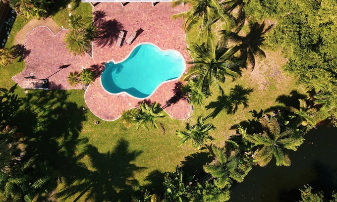 Tamarac House | Palm Tree Paradise House with Private Heated Pool.