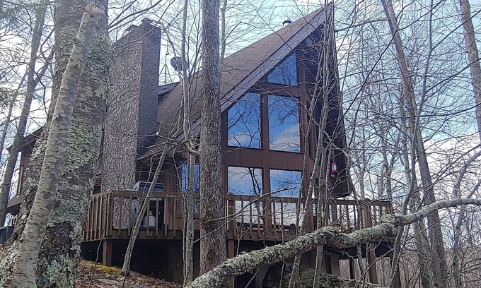 Cresco Ski Chalet | Pocono Private lake setting with, Hot Tub, boat dock, fishing, Swimming, Canoe